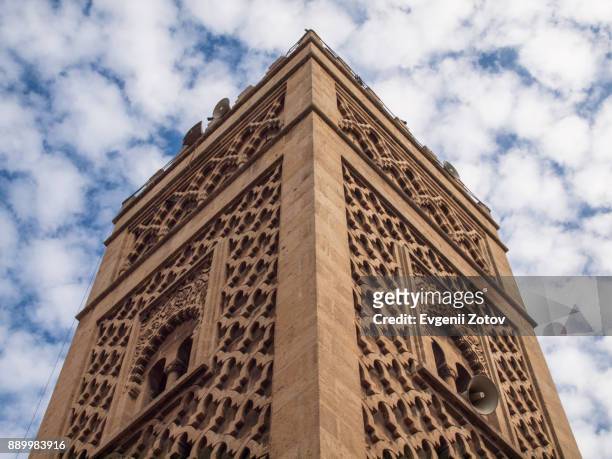 minaret with cloudy sky on background. casablanca, morocco - tower speakers stock pictures, royalty-free photos & images