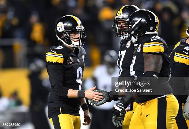 Chris Boswell of the Pittsburgh Steelers celebrates with Chris Hubbard and Cameron Heyward after a field goal in the fourth quarter during the game...