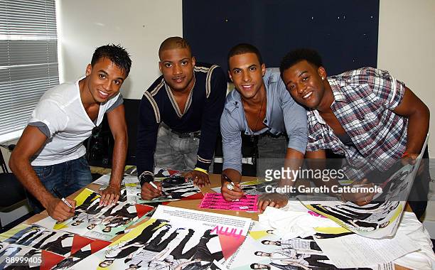 Aston Merrygold, Jonathan "JB" Gill, Marvin Humes and Oritse Williams of JLS sign autographs for fans during the launch of their new single 'Beat...
