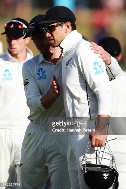Kane Williamson congratulates Ross Taylor of New Zealand at the close of day three of the Second Test Match between New Zealand and the West Indies...