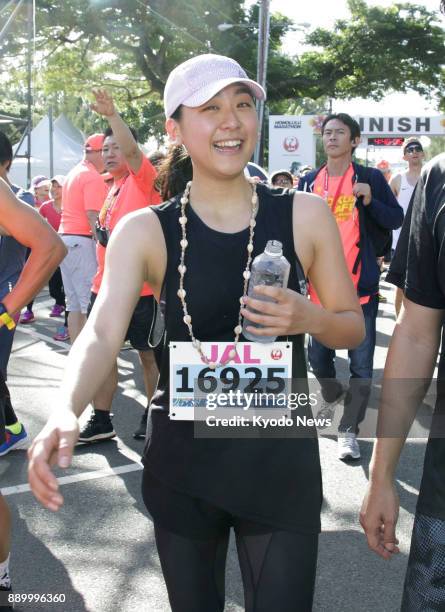 Retired Japanese figure skater Mao Asada smiles after completing her first full-distance marathon in Honolulu on Dec. 10, 2017. The former world...