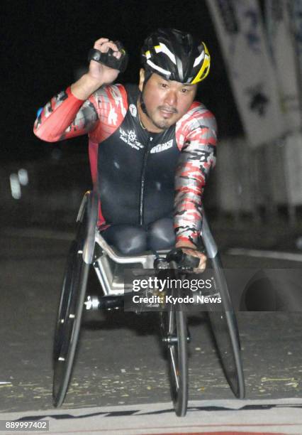 Masazumi Soejima of Japan poses after winning the men's wheelchair division of the Honolulu Marathon on Dec. 10, 2017. ==Kyodo