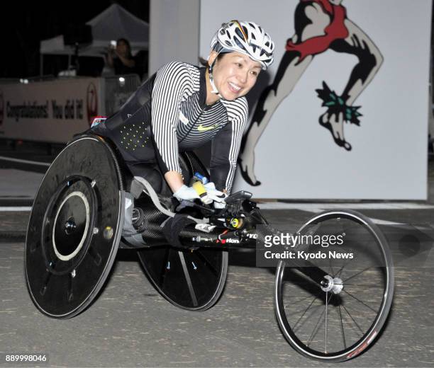 Wakako Tsuchida of Japan poses after winning the women's wheelchair division of the Honolulu Marathon on Dec. 10, 2017. ==Kyodo