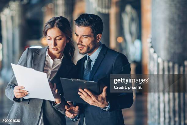discussing important documentation - judicial authority stock pictures, royalty-free photos & images