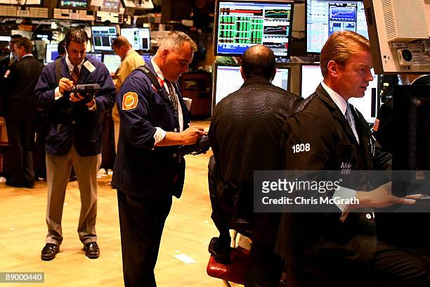 Traders work on the floor near the end of the trading day on the New York Stock Exchange on July 13, 2009 in New York City. A rise in bank stocks saw...