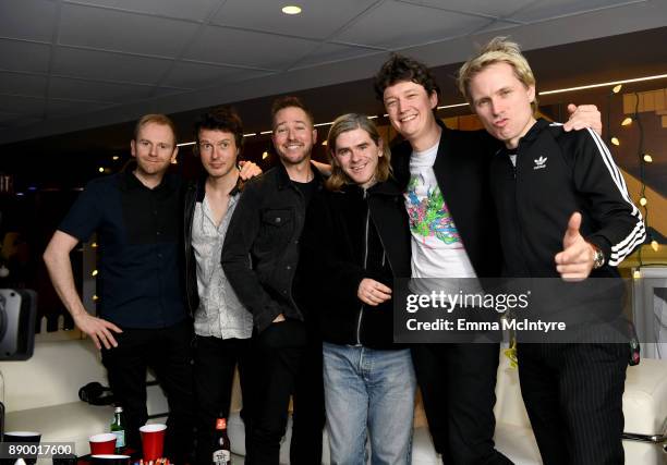 Stryker poses backstage with Bob Hardy, Julian Corrie, Paul Thomson, Dino Bardot and Alex Kapranos of Franz Ferdinand pose backstage during KROQ...