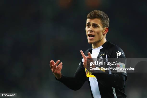 Thorgan Hazard of Borussia Monchengladbach speaks to a team mate during the Bundesliga match between Borussia Moenchengladbach and FC Schalke 04 at...