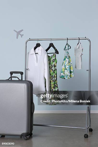 Familys Summer Clothes Hanging On Clothes Rack Ready For Vacation High ...