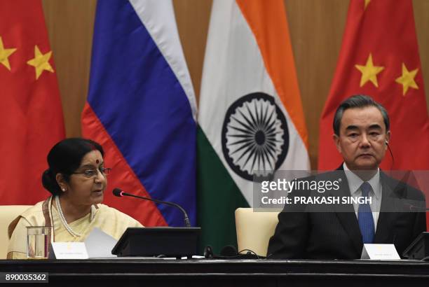 Indian External Affairs Minister Sushma Swaraj and Chinese Foregin Minister Wang Yi take part in a press conference following a trilateral meeting in...