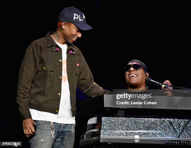 Pharrell Williams and Stevie Wonder perform onstage during Stevie's 21st Annual House Full of Toys Benefit Concert at Staples Center on December 10,...