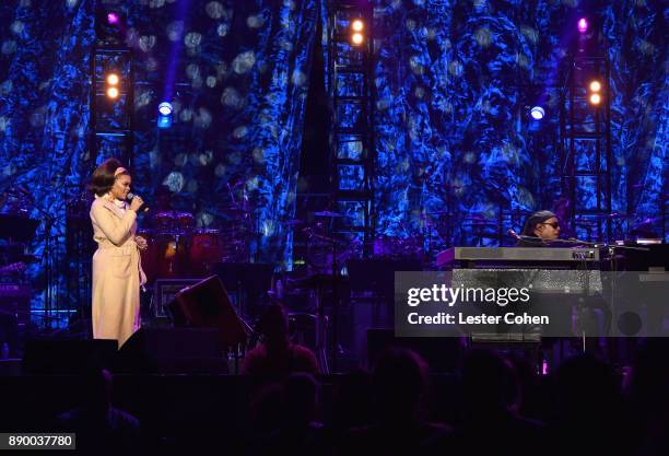 Andra Day and Stevie Wonder perform onstage during Stevie's 21st Annual House Full of Toys Benefit Concert at Staples Center on December 10, 2017 in...