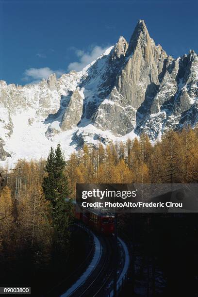 train moving through the alps - chamonix train stock pictures, royalty-free photos & images