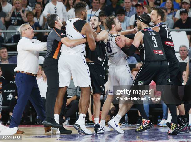 Jeremy Tyler of the Kings comes to grips with Chris Goulding of United after a contest during the round nine NBL match between Melbourne United and...