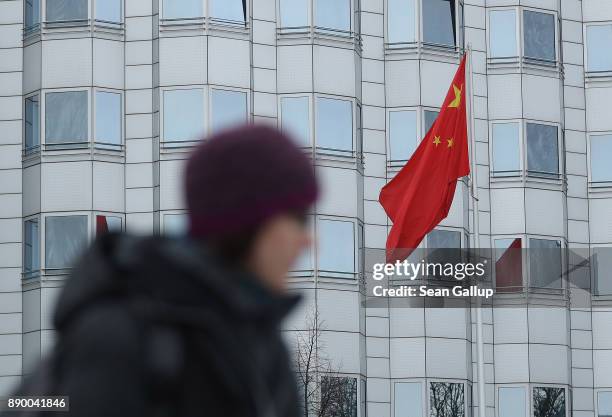 Woman walks past the Chinese Embassy on December 11, 2017 in Berlin, Germany. Hans-Georg Maassen, the head of the German intelligence service, the...