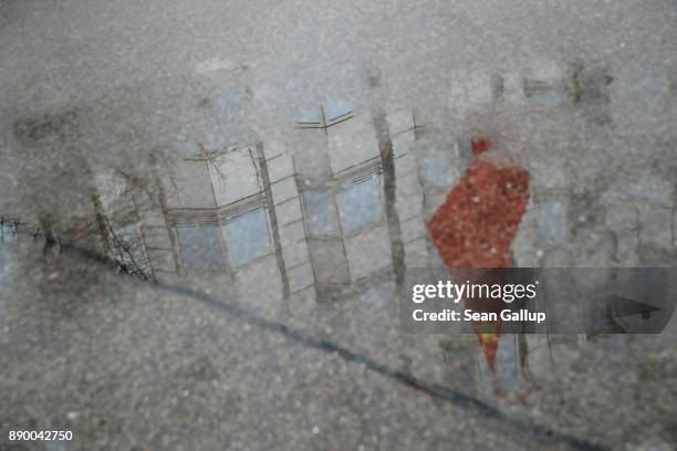 The Chinese flag and Chinese Embassy are seen reflected ona wet road on December 11, 2017 in Berlin, Germany. Hans-Georg Maassen, the head of the...