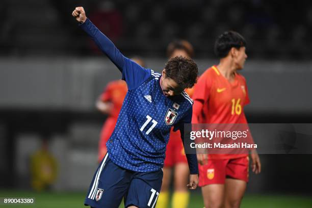 Mina Tanaka of Japan celebrates scoring the opening goal during the EAFF E-1 Women's Football Championship between Japan and China at Fukuda Denshi...