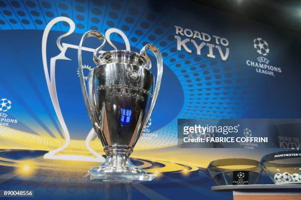 The Champions League trophy is displayed prior to the draw for the round of 16 of the UEFA Champions League football tournament at the UEFA...
