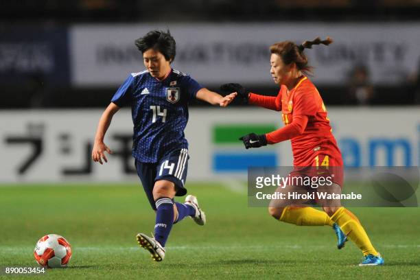 Yu Nakasato of Japan and Xu Yanlu of China compete for the ball during the EAFF E-1 Women's Football Championship between Japan and China at Fukuda...