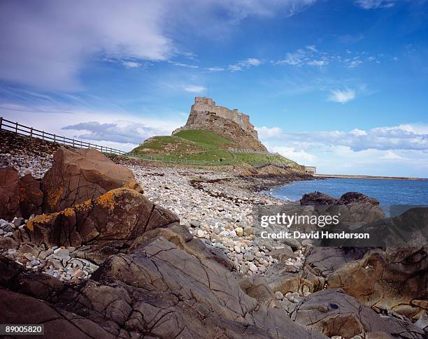 shoreline of holy island, northumberland, england - henderson island stock pictures, royalty-free photos & images