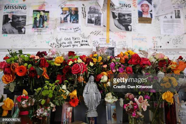 Tributes still stand near Grenfell Tower on December 11, 2017 in London, England. An inquiry into the Grenfell Tower fire was is due to open for two...