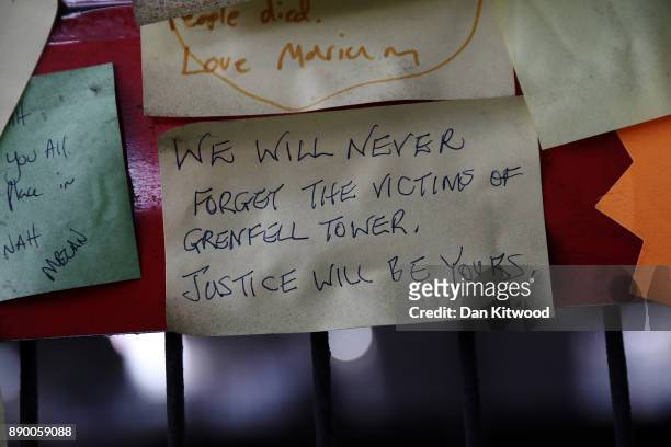 Tributes still hang near Grenfell Tower on December 11, 2017 in London, England. An inquiry into the Grenfell Tower fire was is due to open for two...