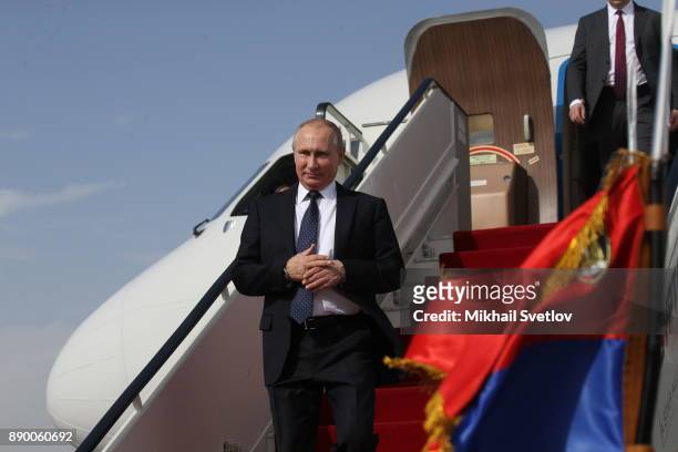 Russian President Vladimir Putin attends a welcoming ceremony at the airport on December 11, 2017 in Cairo, Egypt. Putin is having a one-day trip to...