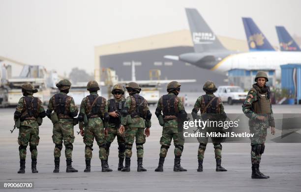 Egyptian special forces soldiers awaits for Russian President Vladimir Putin' arrival proir the welcoming ceremony at the airport on December 11,...