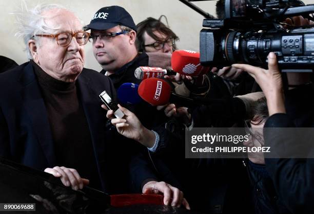 Founder of France's far-right National Front Jean-Marie Le Pen answers journalists' questions as he arrives for the appeal trial in the civil case he...