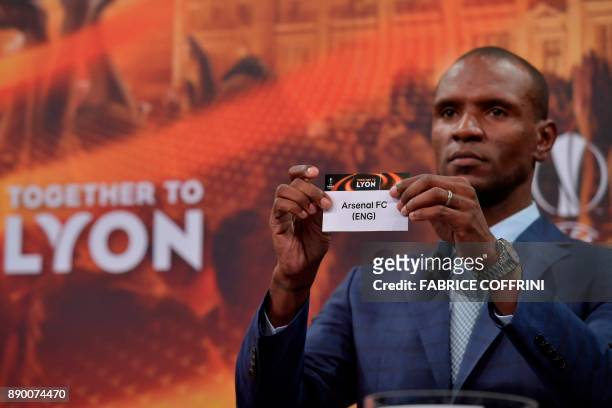 French former international Eric Abidal shows the slip of Arsenal during the draw for the round of 32 of the UEFA Europa League football tournament...