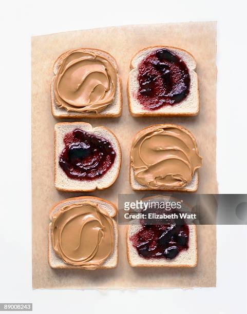 peanut butter and jelly on white bread - peanut butter and jelly sandwich stock pictures, royalty-free photos & images
