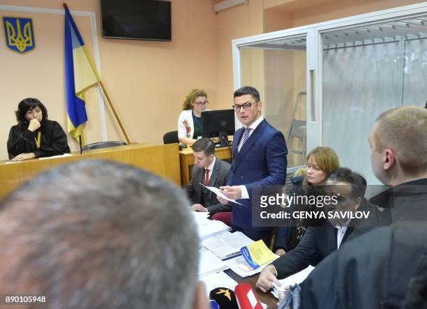 Former Georgian president Mikheil Saakashvili , sitting next to his wife, Sandra Roelofs Saakashvili, attends his hearing at the courthouse of Kiev...