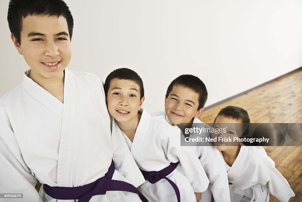 Boys posing in karate uniforms