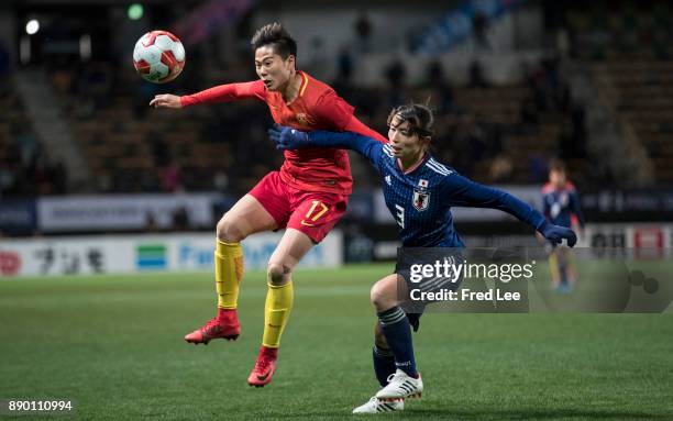 Li ying of China and Sameshima Aya of Japan in action during the EAFF E-1 Women's Football Championship between Japan and China at Fukuda Denshi...