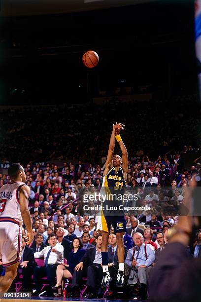 Reggie Miller of the Indiana Pacers shoots a jump shot against the New York Knicks in Game Five of the Eastern Conference Semifinals during the 1994...