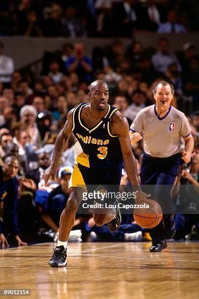 Haywoode Workman of the Indiana Pacers moves the ball up the court against the New York Knicks in Game Five of the Eastern Conference Semifinals...
