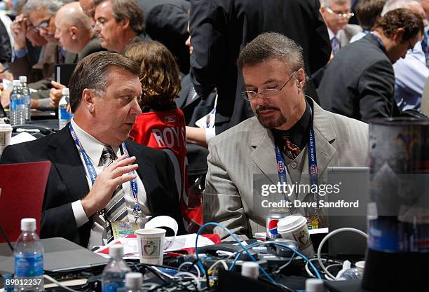 General Manager Don Waddell and Associate General Manager Rick Dudley of the Atlanta Thrashers share a conversation at the Thrashers draft table...
