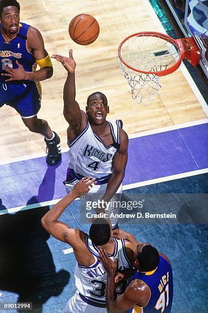Chris Webber of the Sacramento Kings shoots a layup against the Los Angeles Lakers in Game Four of the Western Conference Quarterfinals during the...