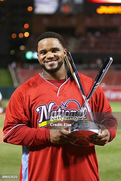 National League All-Star Prince Fielder of the Milwaukee Brewers celebrates with the trophy after winning the State Farm Home Run Derby at Busch...