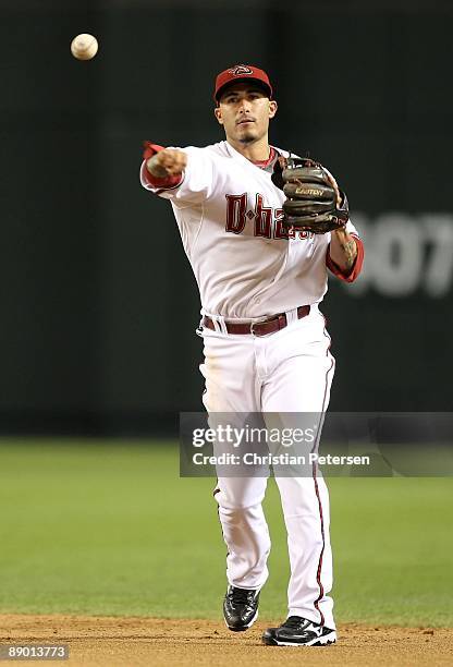 Infielder Felipe Lopez of the Arizona Diamondbacks fields a ground ball out against the Florida Marlins during the major league baseball game at...