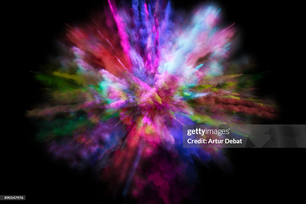 Colorful powder explosion in all directions in a nice composition with vivid colors and black background.