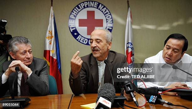 Freed Italian hostage Eugenio Vagni gestures during a press conference at the Philippine Red Cross headquarters in Manila on July 14, 2009 while...