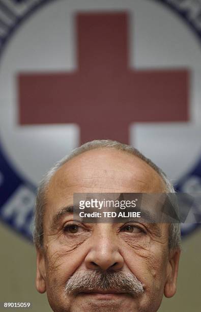 Freed Italian hostage Eugenio Vagni listens during a press conference at the Philippine Red Cross headquarters in Manila on July 14, 2009. Italian...