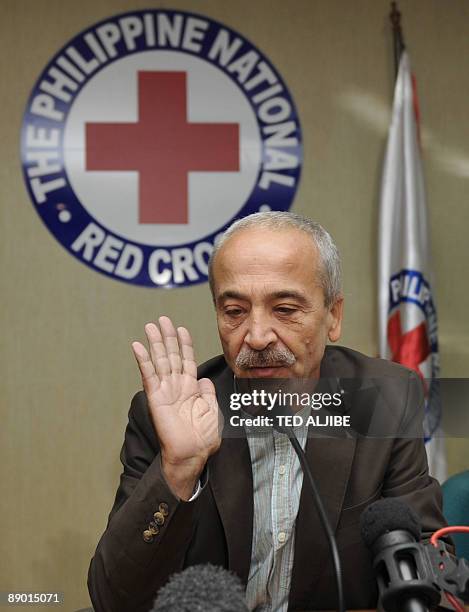 Freed Italian hostage Eugenio Vagni gestures during a press conference at the Philippine Red Cross headquarters in Manila on July 14, 2009. Italian...