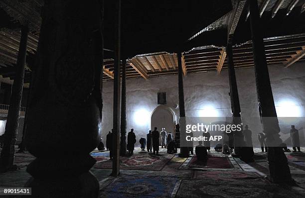 Tajiks pray in the village of Garm, some 250km from Dushanbe, on July 12, 2009. A secretive military operation has raised fears that Islamist...