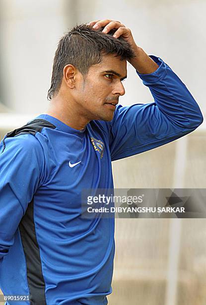 Indian cricketer S. Badrinath gestures as he attends a camp at the National Cricket Academy in Bangalore on July 14, 2009. The NCA organised a...