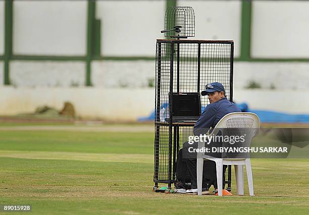 Indian cricketer S. Badrinath inspects video clips of his batting on a laptop while attending a camp at the National Cricket Academy in Bangalore on...