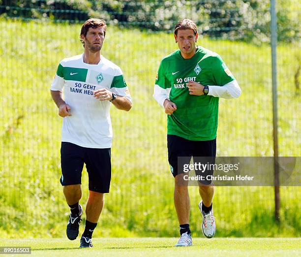 Fitness Coach Yann-Benjamin Kugel and goalkeeper Tim Wiese in action during the training session of SV Werder Bremen on July 14, 2009 in Bad...