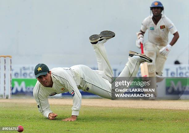 Pakistan cricketer Misbah-ul-Haq attempts to field a ball during the third day of the second Test match between Pakistan and Sri Lanka at The P....