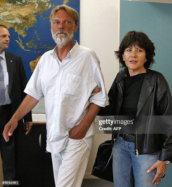 Freed Swiss hostage Werner Greiner arrives with his wife Gabriella Burco for a press conference upon his arrival on July 14, 2009 at Zurich airport....