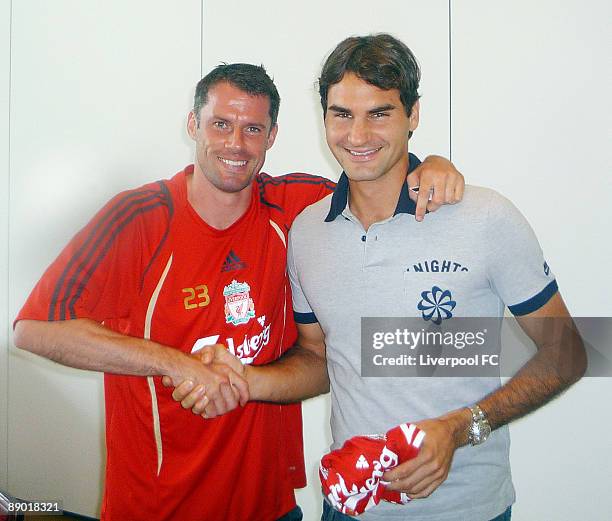 Roger Federer meets Liverpool's Jamie Carragher in Bad Ragaz on July 14, 2009 in Bad Ragaz, Switzerland.